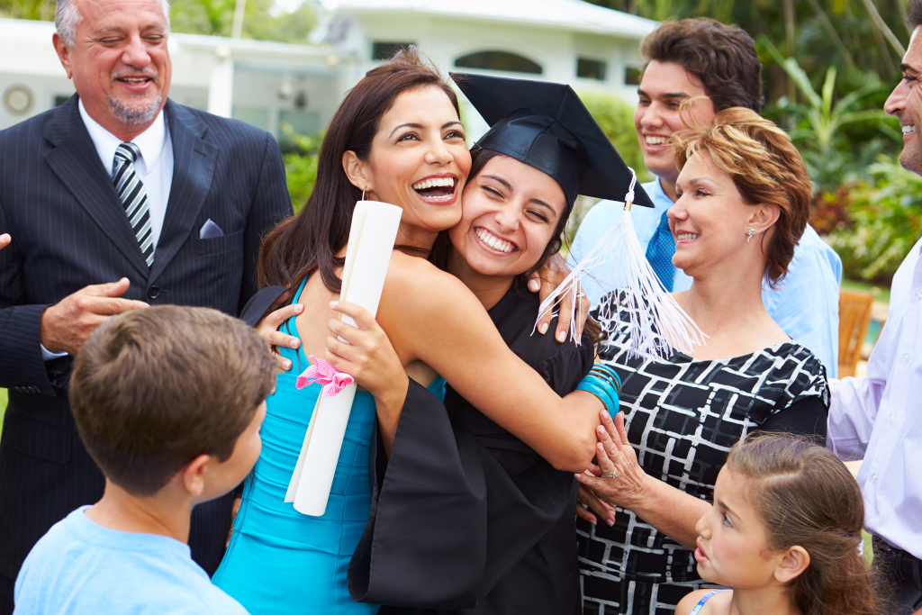 family celebrating daughters graduation